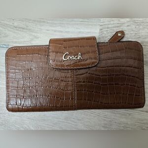 Coach Brown leather wallet with multiple slots and zipper